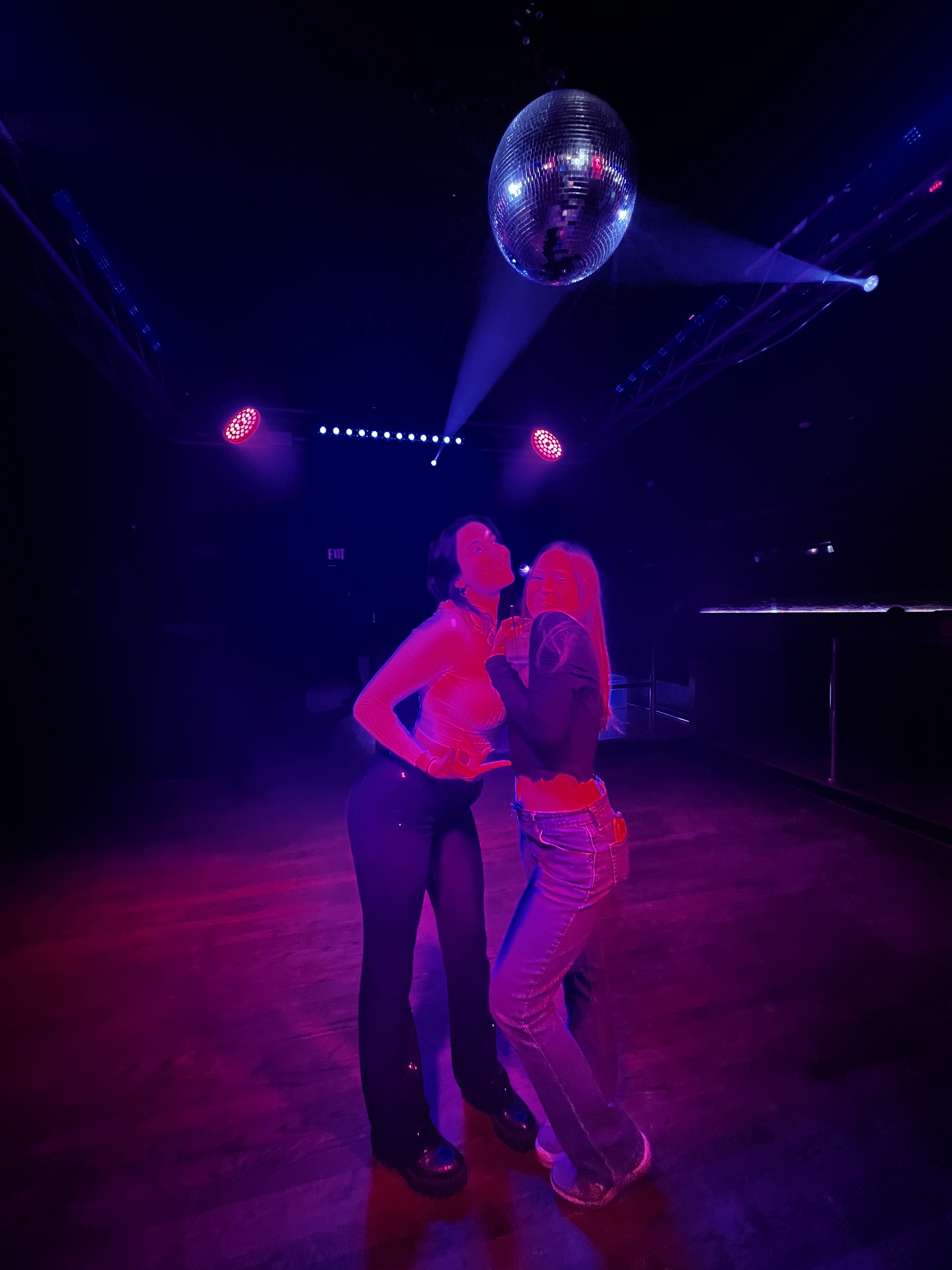 Photo of Nicole and friend at a disco